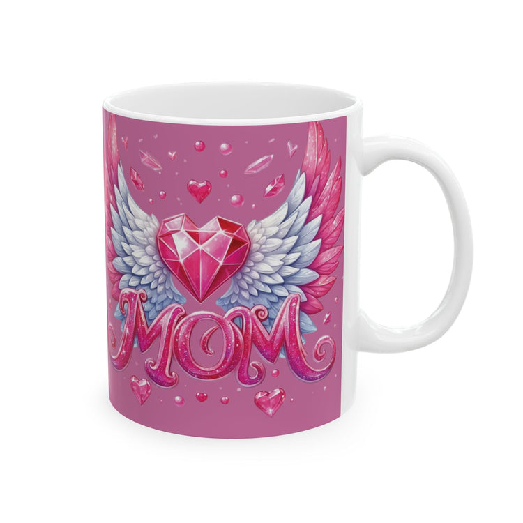 This vibrant artwork features a radiant pink gemstone heart adorned with elegant angel wings in soft pastel hues of white and rose. Sparkling with love, the shimmering pink “MOM” lettering ties the entire piece together